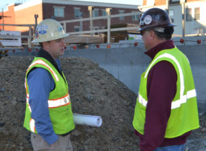 Engineer talking to contractor at project site